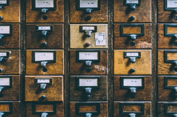 A vintage cabinet with many drawers. How design systems might once have been organised and stored