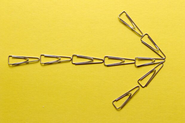An image of an arrow made from paper clips