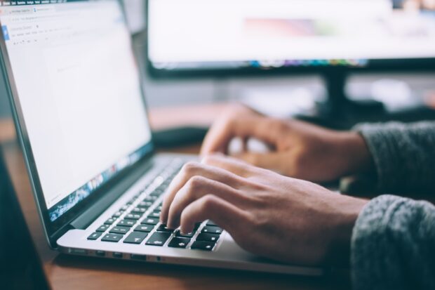 An image of hands at a keyboard