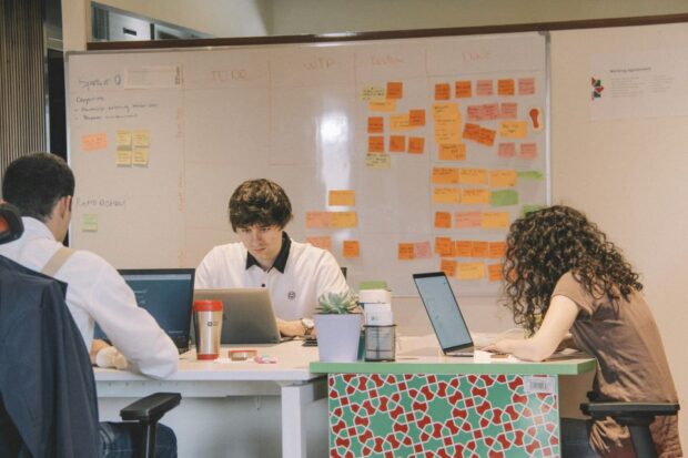 An image of a user centred design team working together on a service design.